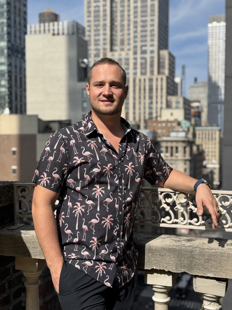 Ben, owner of Precision Lock & Key, standing in front of the service van in downtown Spokane