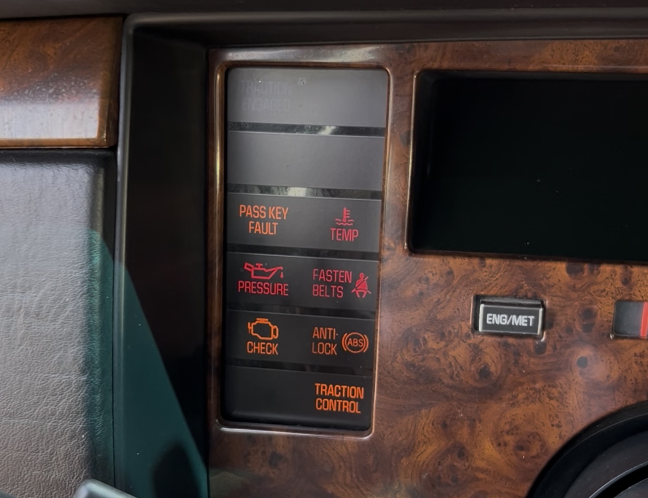 PASS KEY FAULT warning light lit up on the 1994 Cadillac Fleetwood instrument cluster alongside CHECK ENGINE and other warning indicators