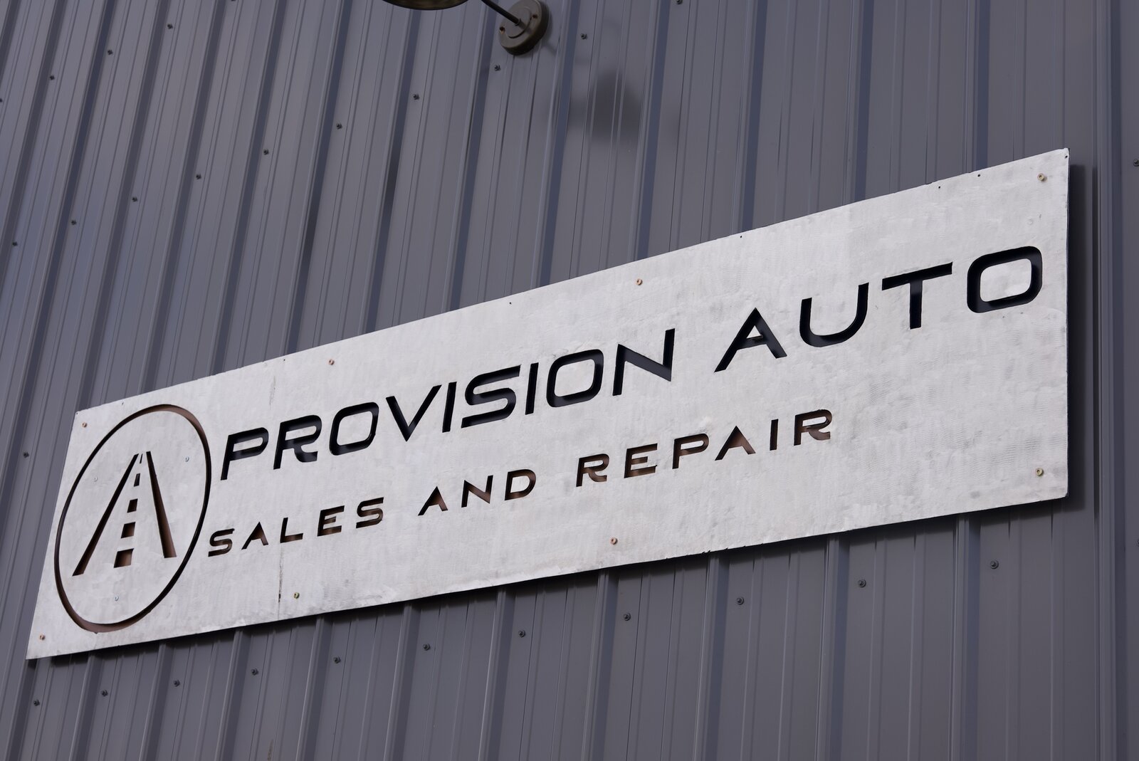 Provision Auto Sales and Repair storefront sign on metal building