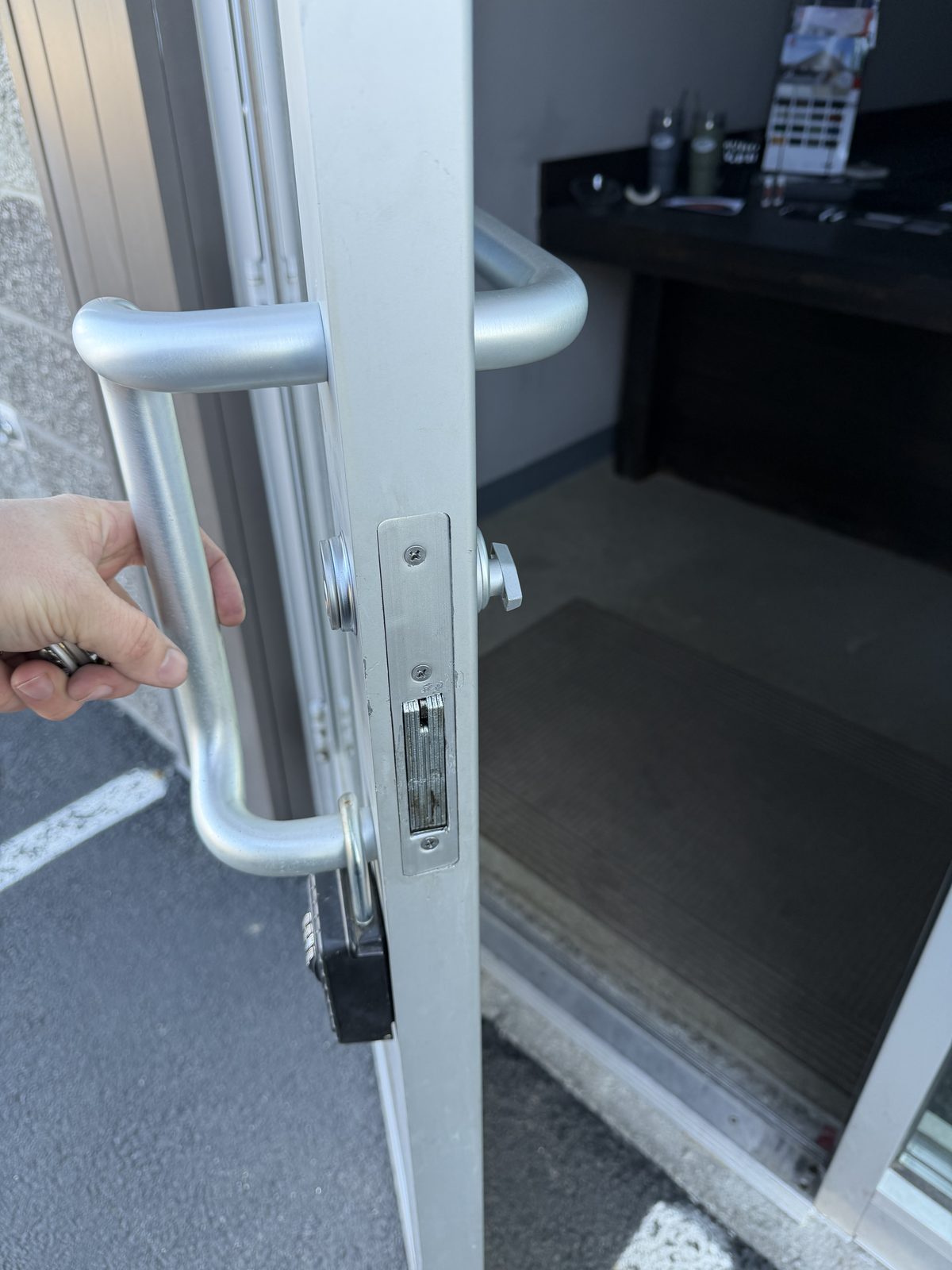 Repaired mortise lock assembly on commercial door showing proper alignment