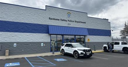 Spokane Valley Police Department building with patrol vehicles parked outside